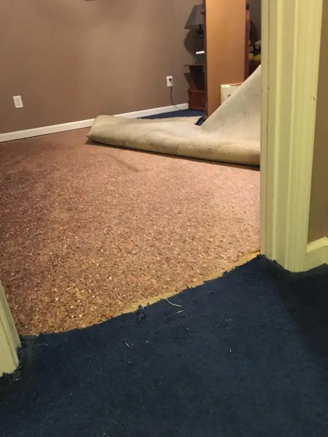 Carpet pad removal revealing water damage during Water Mitigation Services in Crooked River Ranch